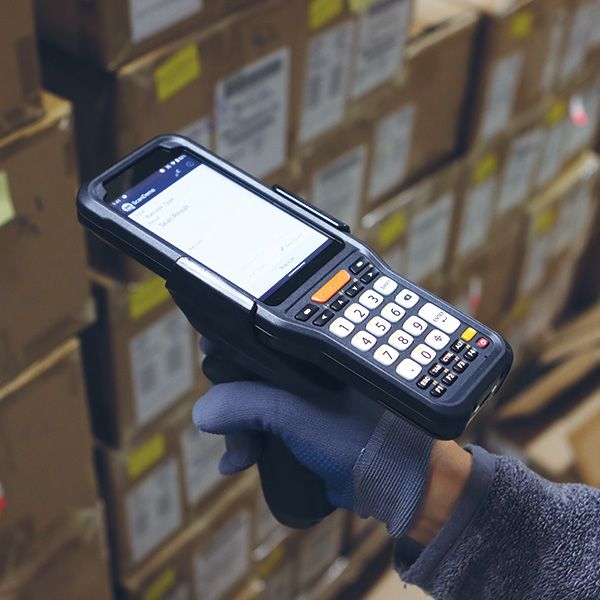 Handheld Point Mobile M351 in hand in warehouse